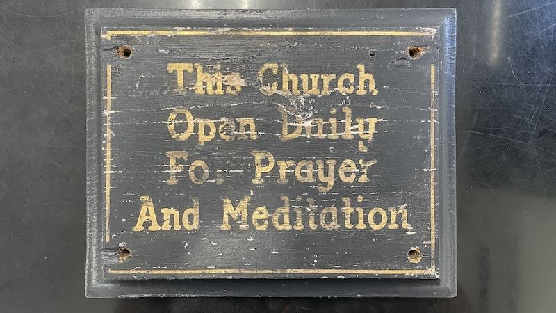 Painted sign: This church open daily for prayer and meditation